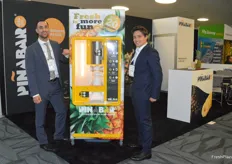 Michael van Keeken and Calo Cimo of Dutch Food Technology presenting their machine which makes slices or cubes from a pineapple in just some seconds. It fits in the convenience trend but also adds some extra experience.